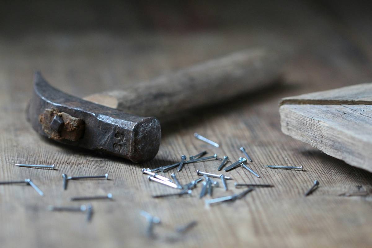 Before: bent nails and split wood. After: clean, flush-driven nails in cedar fence